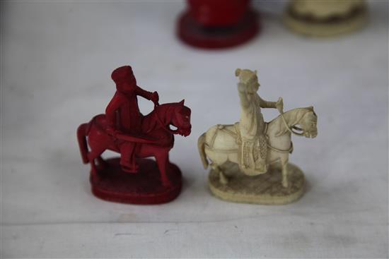 A 19th century Macau carved and stained ivory chess set, king 4.75in.